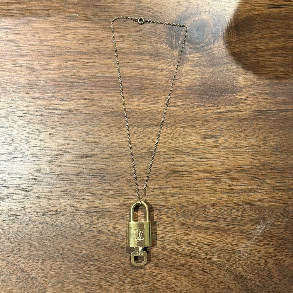 LV gold tone lock and key set on a gold chain (number 342)
